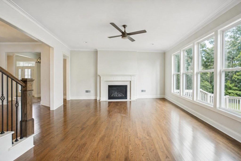 Empty living room with clean floors and spotless surfaces after a professional move-in clean in Apex NC